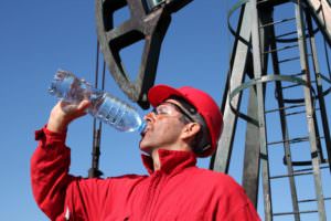 petrochemical worker drinking water after overheating